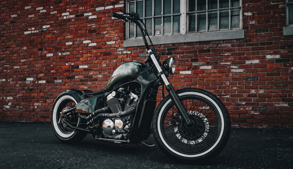 Custom motorcycle equipped with premium whitewall tire inserts for vintage styling